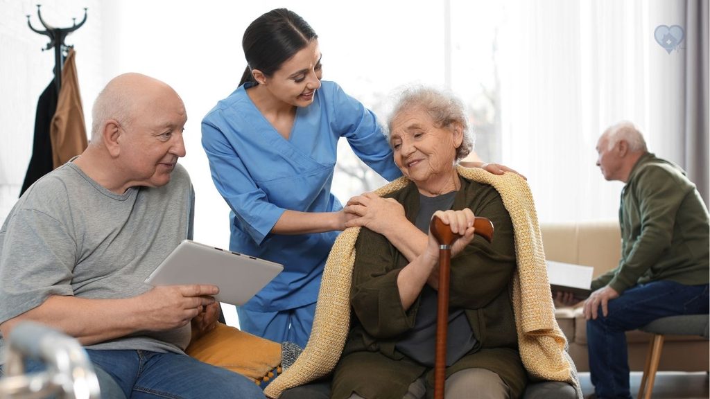 a elderly couple being conforted by a hospice nurse