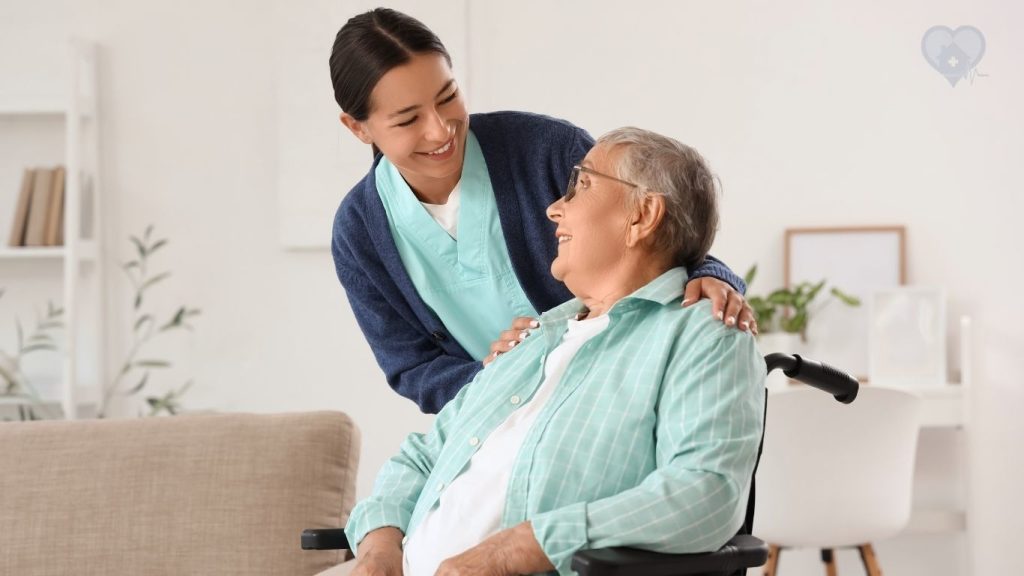 A hospice nurse speaking with an adult daughter during a home visit