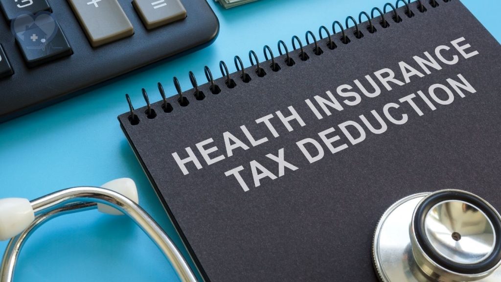 a notebook with a title that says health insurance tax deduction.